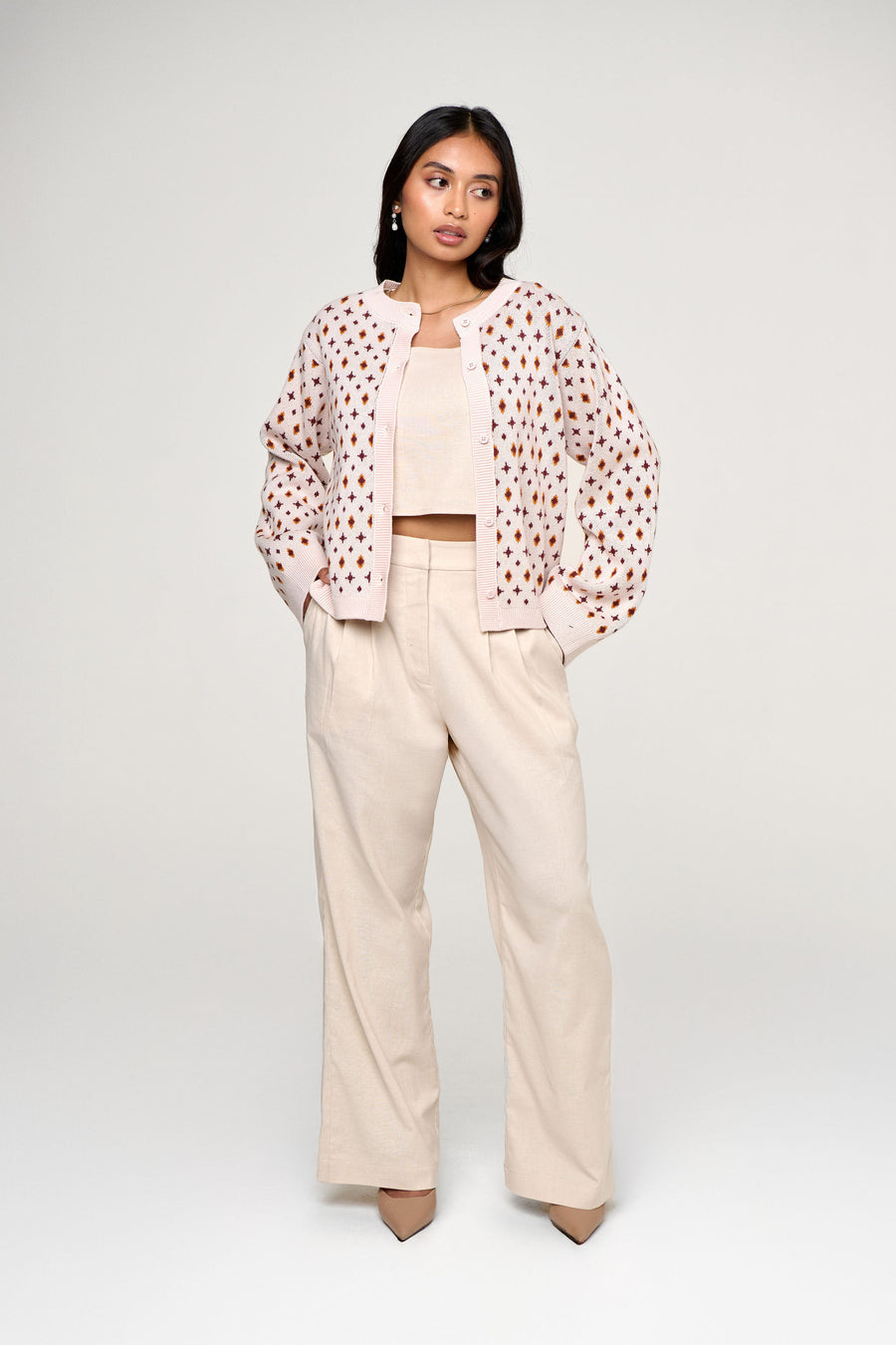 Woman wearing a petite linen pants and top set with a Jacquard Cardigan designed and proprtioned for shorter women 5"4 and under.