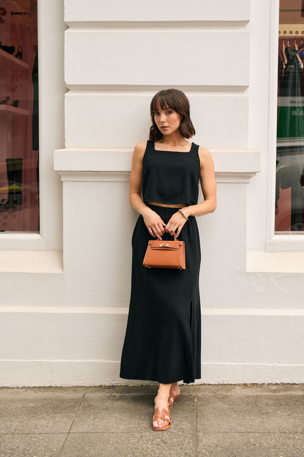 Woman wearing a petite maxi set with a matching linen skirt and top